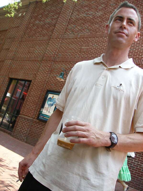 Jeff Johnson drinks Mudhouse coffee on the pedestrian mall in Charlottesville, Virginia.