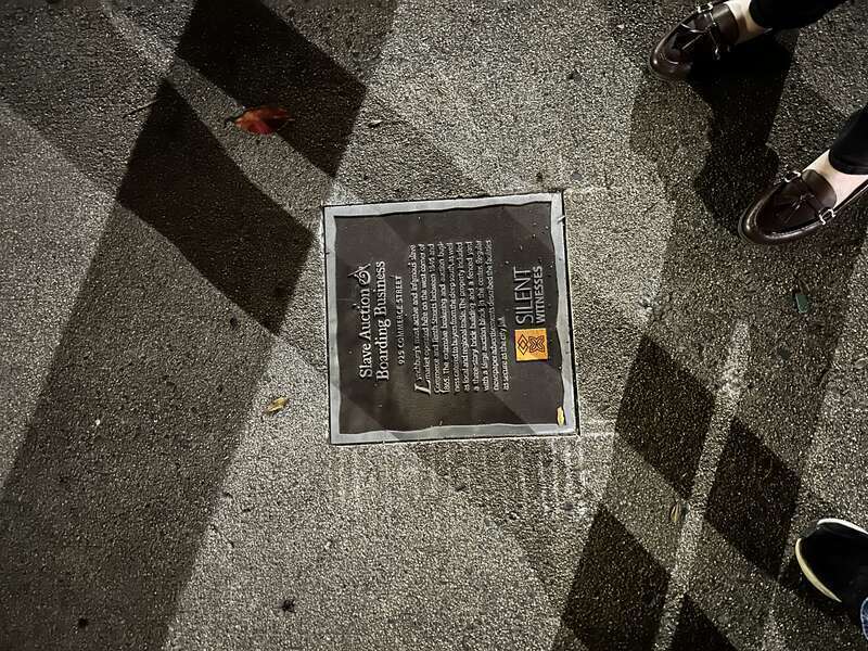 A marker from the Silent Witnesses project, commemorating the location of a prominent slave market in town. The plaque reads as follows: Slave Auction &amp;amp; Boarding Business 925 Commerce Street Lynchburg’s most active and infamous slave market