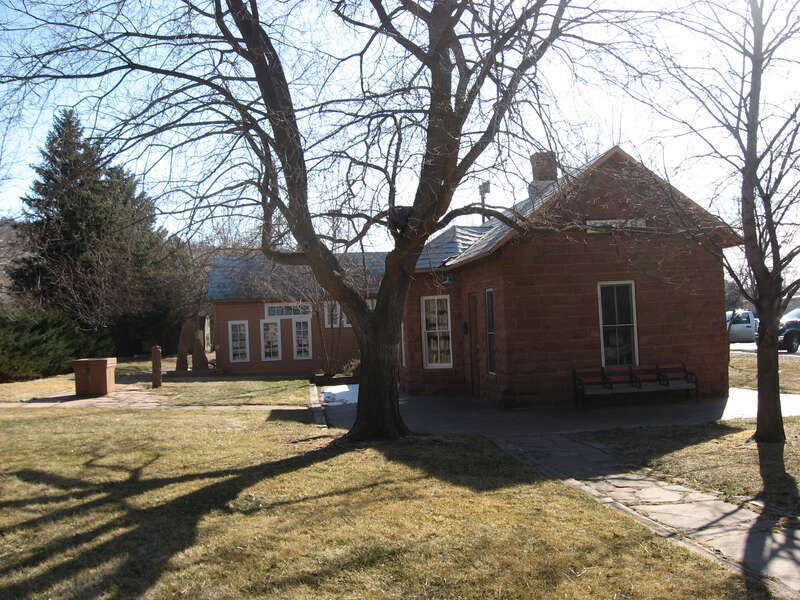 Western side of the Lyons Depot Library, located along Broadway in Lyons, Colorado, United States.  Now a library, the building was opened in 1885 as the Lyons Railroad Depot.  It is listed on the National Register of Historic Places.