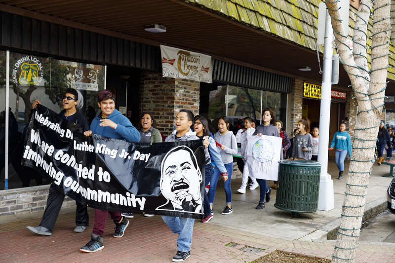 Holding Black sign – Joseph, Rico, Clarence