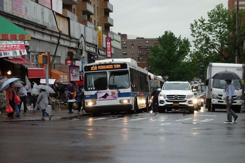A Ridgewood Terminal-bound Q58 local bus entering service at the route's terminus at Main Street and 41st Road in Downtown Flushing, Queens.