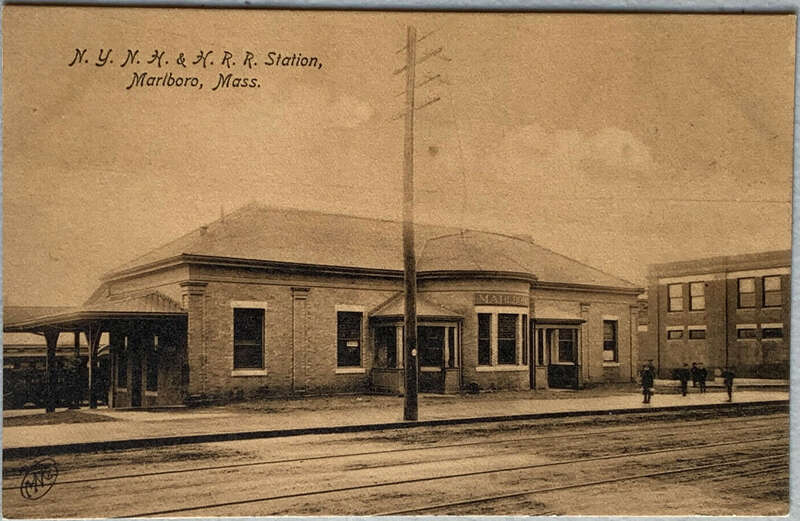 Undivided back postcard of Marlboro station on the New Haven Railroad. The tracks in the foreground were used by the Boston and Worcester Street Railway's Hudson Branch.