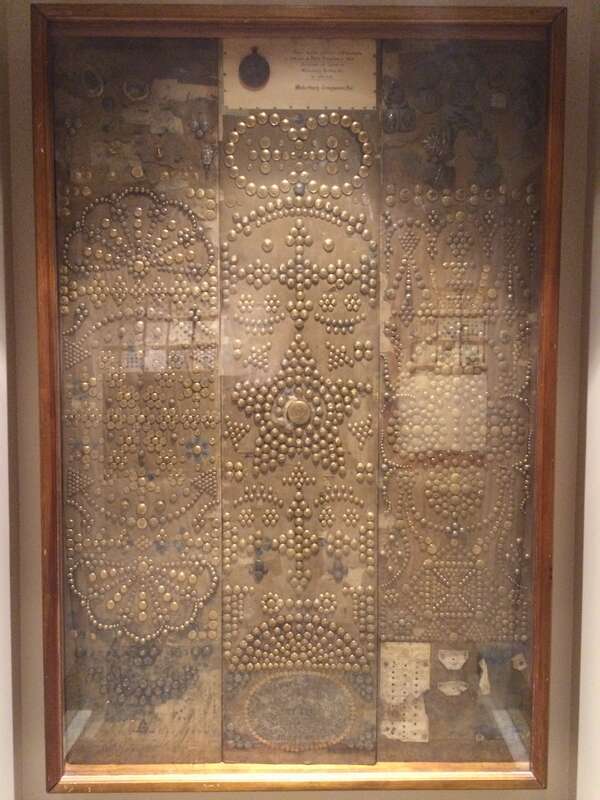 Decorative display of brass tacks