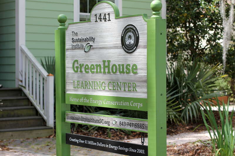 North Charleston Mayor R. Keith Summey visits with the Sustainability Institute's Energy Conservation Corps at their Green House on East Montague.

Photo by Ryan Johnson