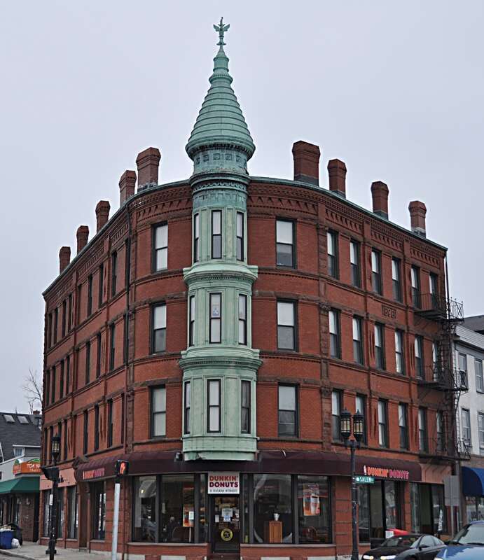 A photograph of the historic Bigelow Block in downtown Medford, Massachusetts.