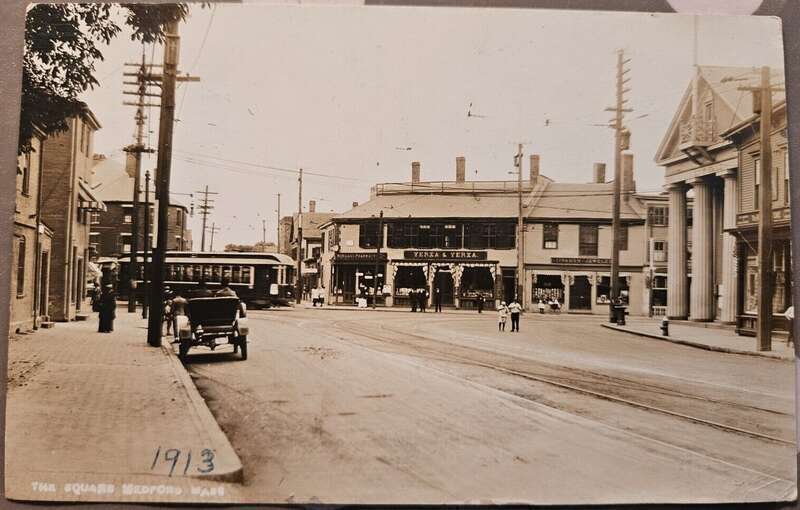 Divided back postcard of Medford Square, postmarked 1913. A streetcar on the Salem Street–Sullivan Square route, later route 101, is visible.