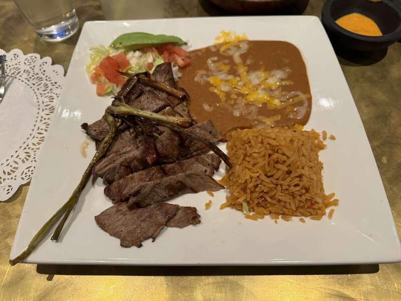 Carne asada with a side of rice and refried beans at Mi Pueblo Santa Rosa