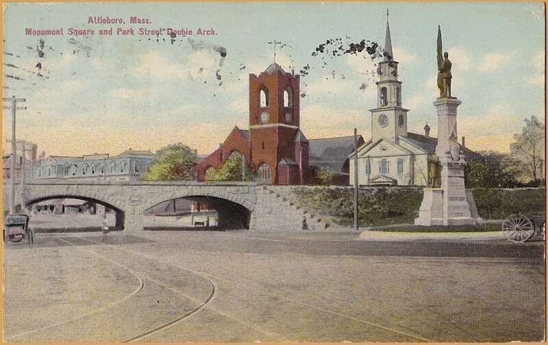 Divided back postcard of Monument Square and the Park Street double arch bridge in Attleboro, Massachusetts. The streetcar track diverging at left leads to the loop on Union, Mill, and South Main.