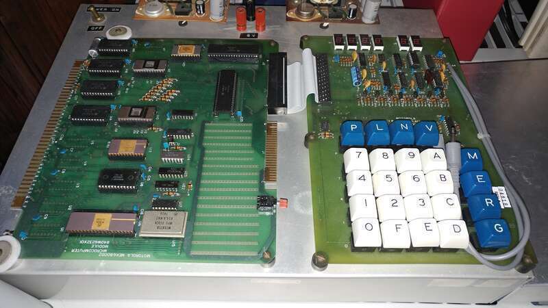 A Motorola MEK6800D2 Microcomputer, in the collection of the Microcomputer Museum of America.  To the left is the main Microcomputer Module containing the MC6800 Microprocessor, RAM and ROM memory (JBUG Monitor program), Clock Module, I/O chips, and