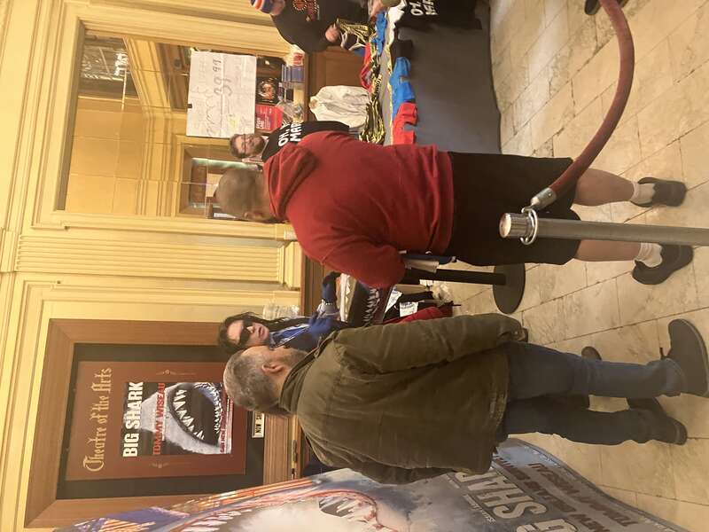 Tommy Wiseau surrounded by fans at the 2024 screening of The Room