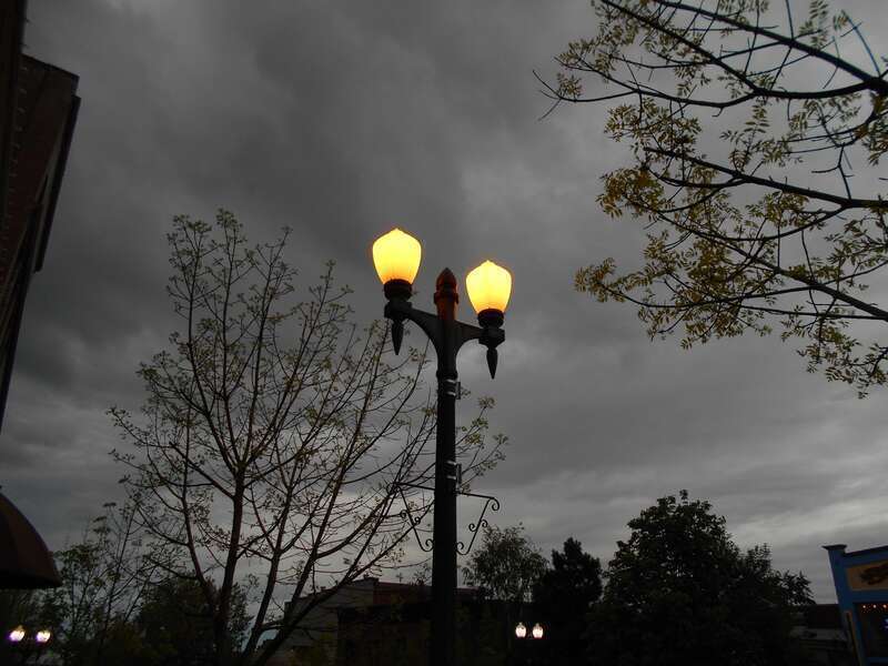 Old fashioned sodium vapor streetlamps in Fairhaven District.  The bulbs are now being replaced by white LEDs.