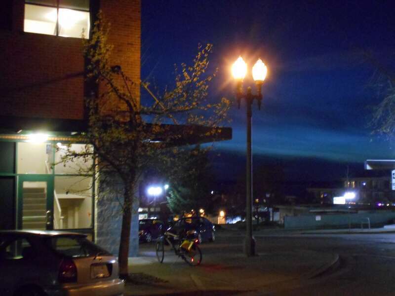 Old style is the yellow of sodium vapor lights.  In background, new style is LED which happens to be white.  My bike is pictured also with it's LED lights that go around with the wheels.