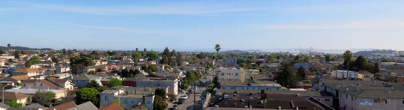 Panorama from the parking garage of Richmond station in April 2018. The skylines of Oakland and San Francisco are visible in the distance.