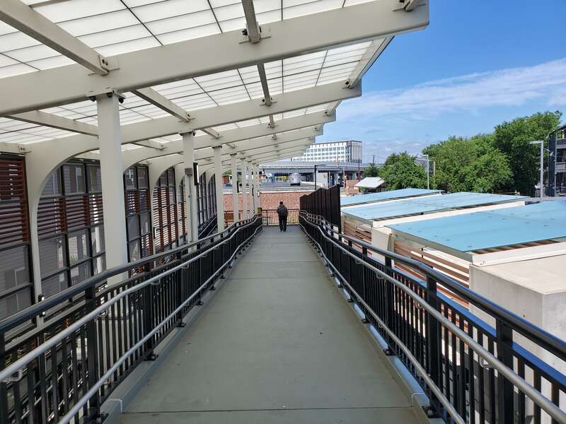 The ramp structure from Washington Street to the inbound platform at Bellingham Square station in July 2021