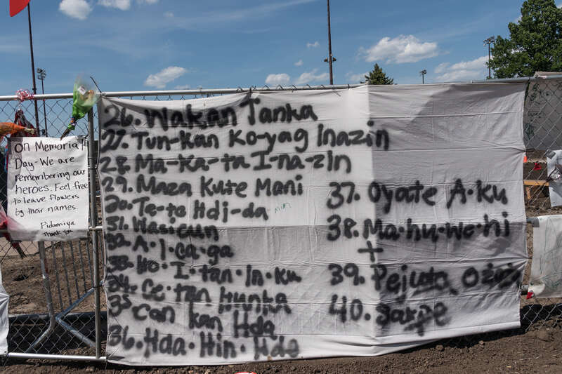 Remember Their names part 3, a sign on the perimeter fence around the Walker's sculpture garden that lists the Native American's executed on December 26. 1862.
Photograph by Lorie Shaull.
&quot;Scaffold,&quot; a wood &amp;amp; steel sculpture by the artist Sam