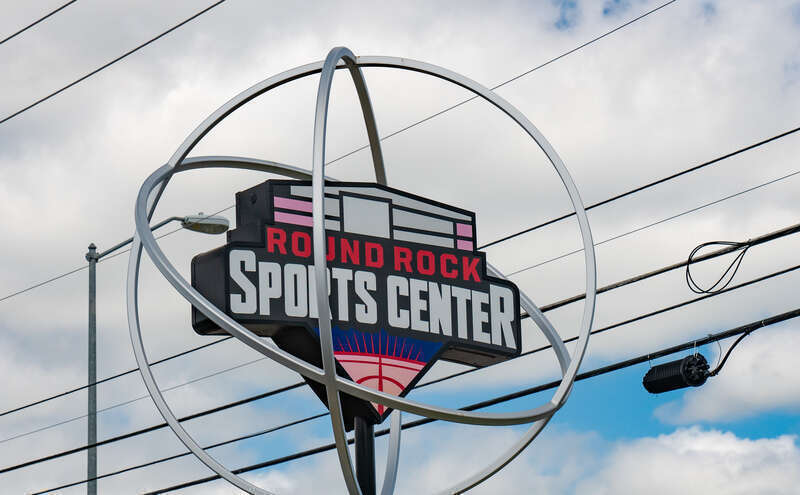 Signage for the Round Rock Sports Center, an indoor sports facility located at at 2400 Chisholm Trail in Round Rock, Williamson County, Texas.