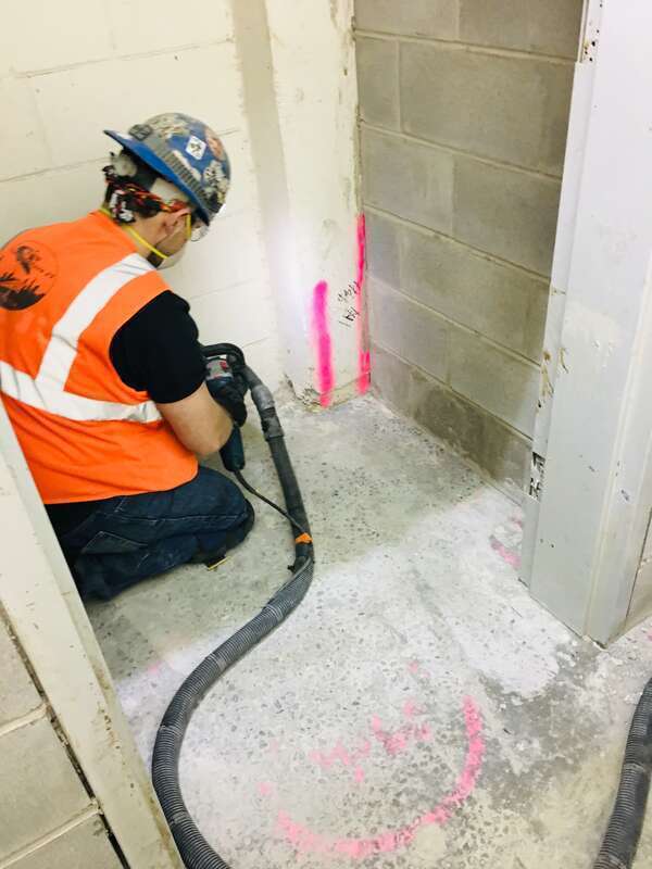 Sanding the floors of the 50th Street ventilation facility. (CM014B, 10-24-2018)