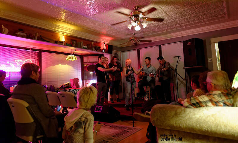 &quot;NAMM Week: Songwriter Series&quot; Songwriters Round at The Ugly Mug Cafe in Orange CA on January 22nd, 2014. Kaela Kinney (tall blonde), Ry Bradley (right), Ryan Terrigno (left), Katelyn Marie (Jack Daniels tshirt), Heidi Howard (dark hair), and Scott