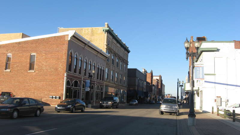 Looking northward along Walnut Street from near the Charles Street junction in Muncie, Indiana, United States.  These blocks are part of the Walnut Street Historic District, a historic district that is listed on the National Register of Historic