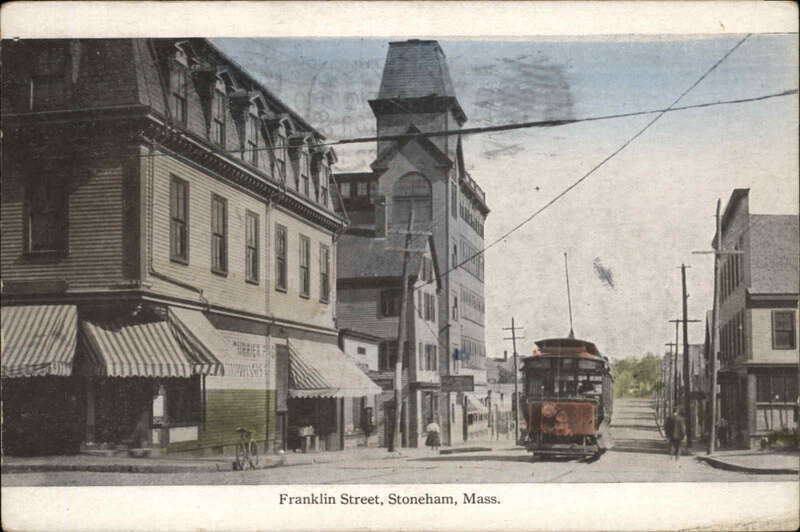 Divided back postcard of a streetcar on Franklin Street at Main Street in Stoneham, Massachusetts, on the Stoneham–Melrose Highlands line. It is postmarked 1922 but likely produced between 1907 and 1915