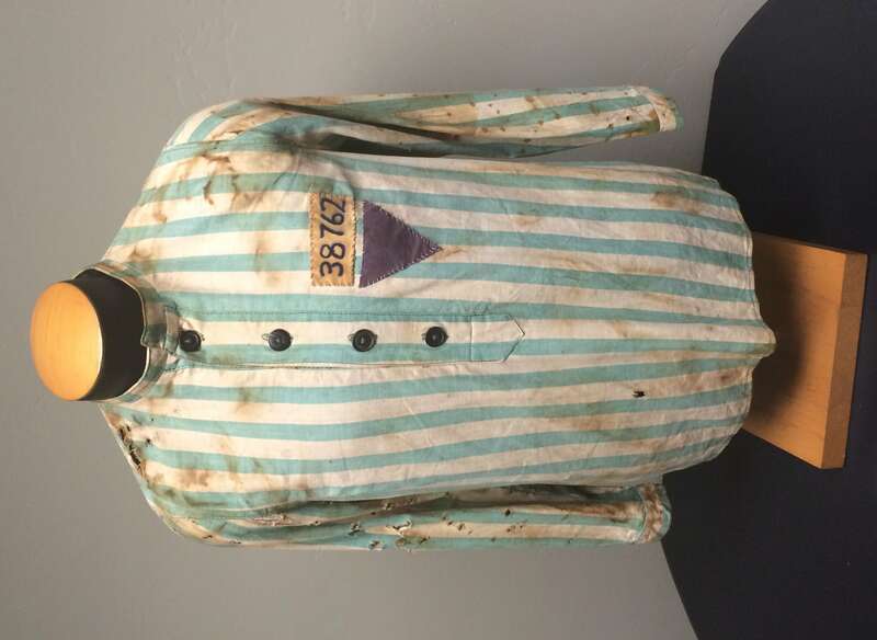 Striped pajamas with purple triangle; 
Persecution of Jehovah's Witnesses in Nazi Germany: Jehovah's Witnesses suffered religious persecution in Nazi Germany between 1933 and 1945 after refusing to perform military service, join Nazi organizations,