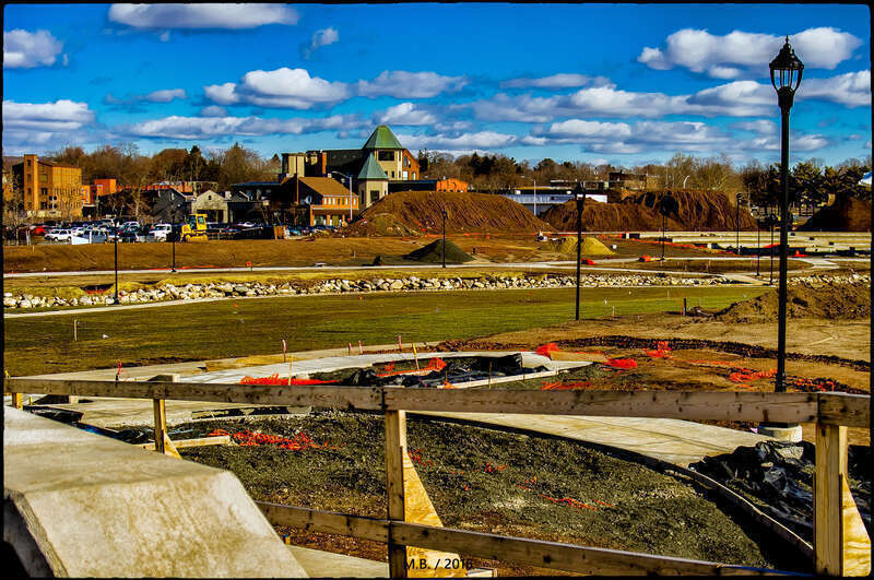 500px provided description: Downtown Meriden, CT taken from Pratt Street, through the fence of the new park being built at the HUB. The park seems to be coming along nicely. I used my Tamron 28-80mm Zoom Lens for this image, taken at 9:15a.m. this