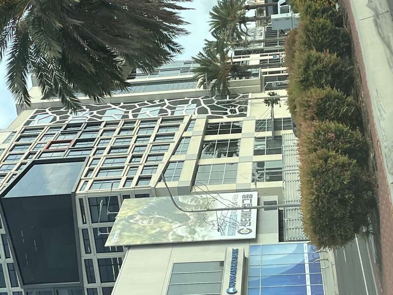 The office tower and shops seen at The Source OC shopping mall. Landscaping and detail along Beach Blvd can also be seen
