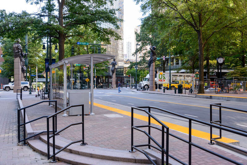 At the platform steps, facing towards One South (formally the Bank of America Plaza).