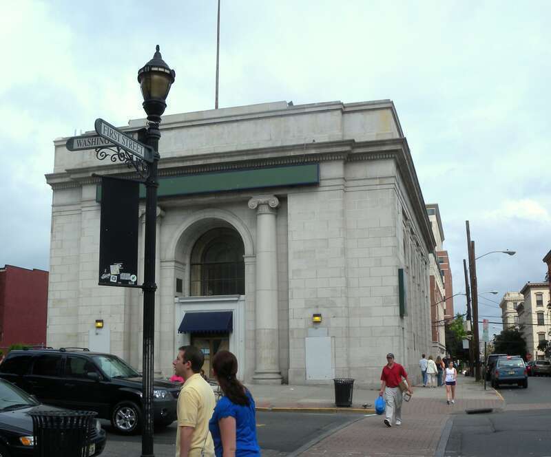 Looking east across Washington St at old bank building on 1st St on a cloudy afternoon.