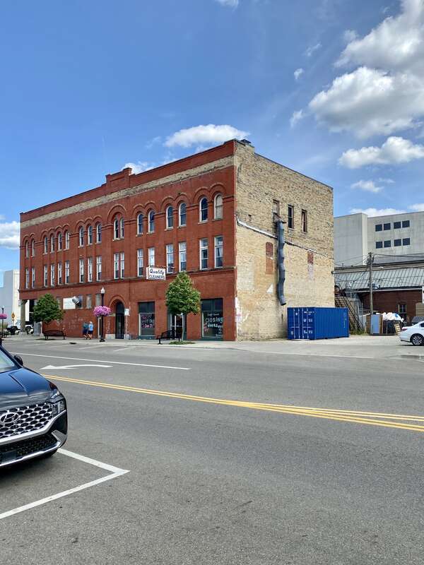 Built in 1899, this Romanesque Revival-style building was built to house a Young Men’s Christian Association (YMCA) serving the city of Newark, Ohio.  The building features a red brick facade along the streets with buff brick on the rear and side