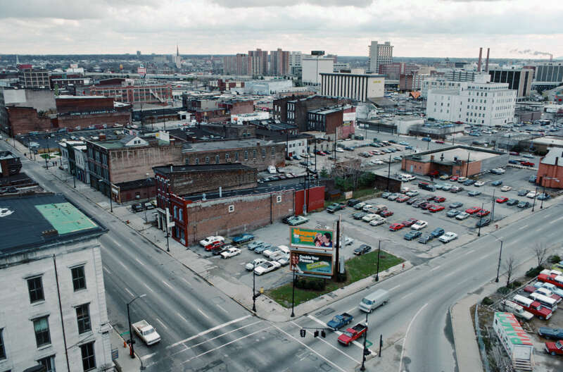 Looking SE from roof of Farm Credit Banks building on north side of Main St. between 2nd and 3rd Sts.
In foreground, intersection of 2nd and Main Sts.
At lower left, part of building (NE corner 2nd and Main) which housed headquarters of &amp;lt;a