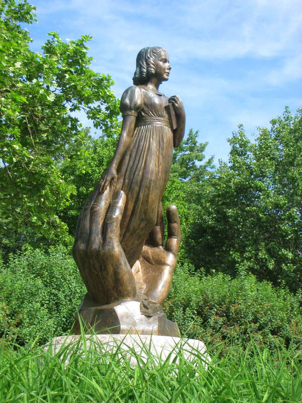 Statue of Alice Cogswell, daughter of a founder of the Connecticut Asylum for the Education and Instruction of Deaf and Dumb Persons (now called the American School for the Deaf), and its first pupil. This statue honors Thomas Hopkins Gaulladet,