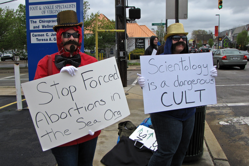 &quot;Anonymous&quot; demonstrators from Washington, DC protest the practices of the Church of Scientology at the organization's Richmond facility.  Due to an anti-mask law in Virginia, demonstrators used fake mustaches and sunglasses instead of Guy Fawkes