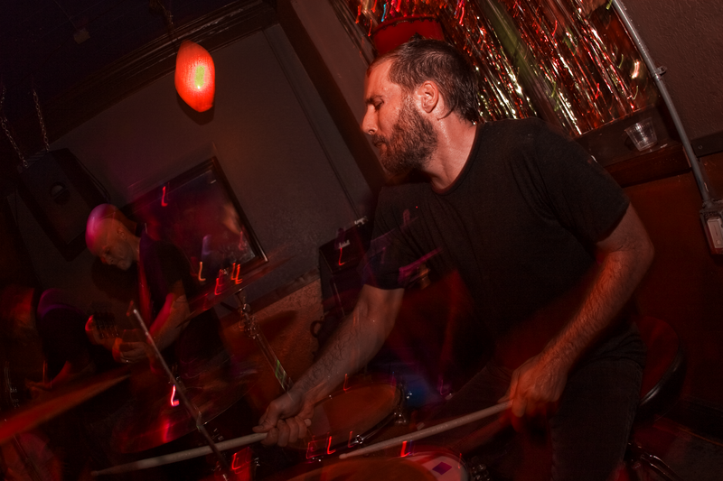 American melodic hardcore band As Friends Rust performing its first reunion show at The Atlantic in Gainesville, Florida on August 15, 2008. From left to right: Joseph Simmons, Kaleb Stewart and Timothy Kirkpatrick.