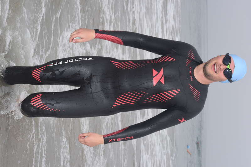 A young man, wearing an Xterra Vector Pro wet suit, exits the water after his warm-up swim during the Second Annual Redondo Beach Open Water Swim held on Sunday, July 14, 2019.

VFJ_0212_cr