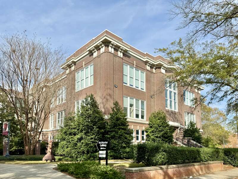 Built in 1911, this Classical Revival-style building was designed by Edwards and Walter to serve as the McMaster School, a segregated whites-only public school.  The building features a red brick exterior, a rusticated base, one-over-one windows, a