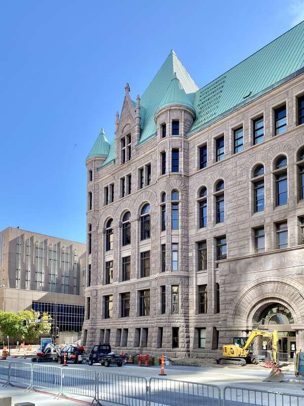 Built between 1888 and 1909, this Richardsonian Romanesque Revival-style rose granite building was designed by Long and Kees, and stands on the site of the former Washington School, the first public school building built on the west side of the