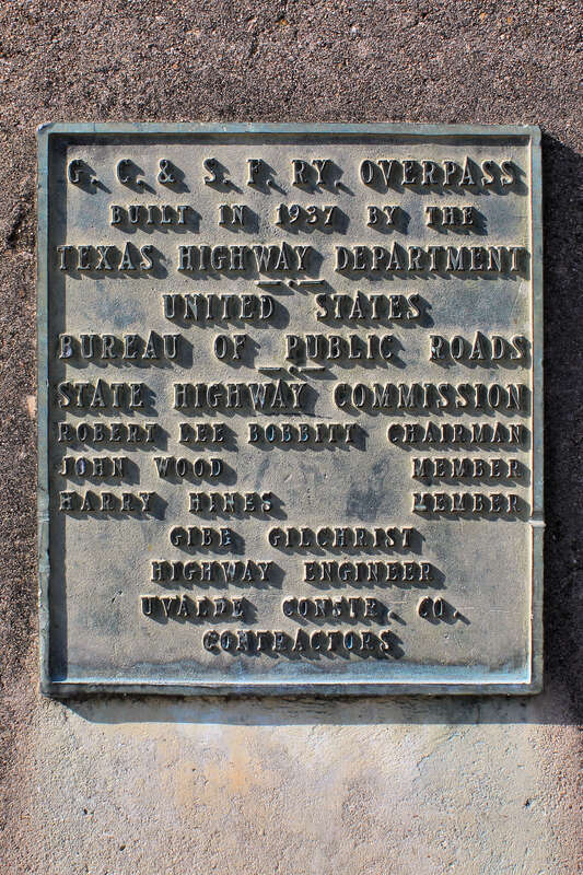 Plaque on the Oakland-Merlin Overpass in Dallas, Texas, United States shows the bridge was originally the Gulf Coast and Sante Fe Railway Overpass built in 1937.