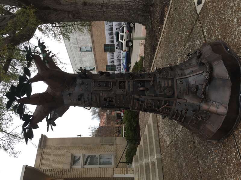 Tree of Good and Evil, painted steel and bronze sculpture by artist Charles Pilkey, on public display behind the Arts Council of Fayetteville, on Hay Street in downtown Fayetteville NC.
