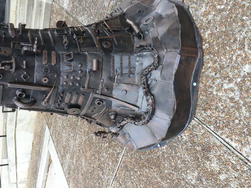 Details. Tree of Good and Evil, painted steel and bronze sculpture by artist Charles Pilkey, on public display behind the Arts Council of Fayetteville, on Hay Street in downtown Fayetteville NC.