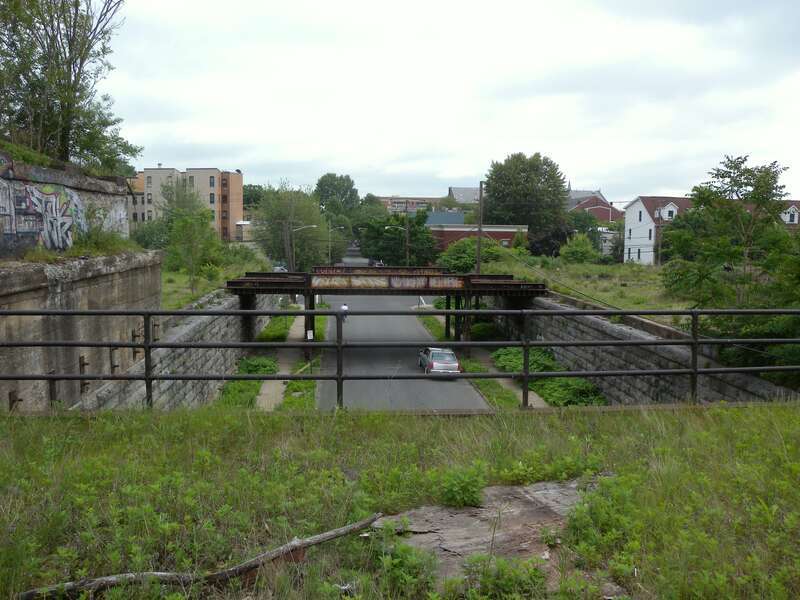 Looking south from main line and along Coles Street, at a branch line heading southeast, on a cloudy afternoon.