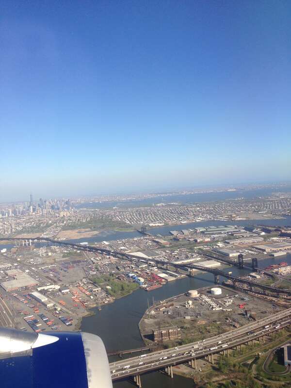 View of the Pulaski Skyway, the New Jersey Turnpike spurs and Lower Manhattan while descending into Newark Liberty International Airport