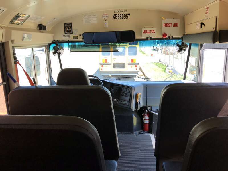 Front-facing interior view from the front of a First Student school bus at a bus depot in East Orange, Essex County, New Jersey