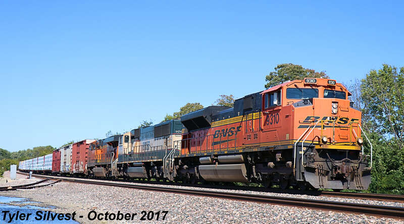 Burlington Northern Santa Fe 9310(SD70ACe), 9764(SD70MAC) and 8255(ES44C4) Lead a Southbound Manifest on the BNSF Fort Scott Sub at the Dennis Avenue Crossing east of Keeler Street in Olathe, Kansas.
Train: H NTWTUL1 06
Video Link: 
Photo Taken: