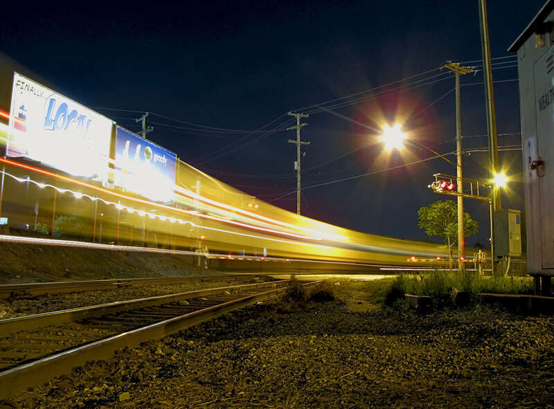After wyeing the train, Train 370 backs across Wealthy street and into the station.