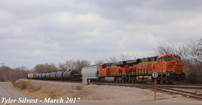 Burlington Northern Santa Fe 6940(ES44C4) and 7252(ES44DC) Leads a Manifest Southbound on the BNSF Fort Scott Sub stopped at the CP 215 Signals just before the Dennis Avenue Crossing East of Keeler Street in Olathe, Kansas.
Photo Taken: 3-6-17 at