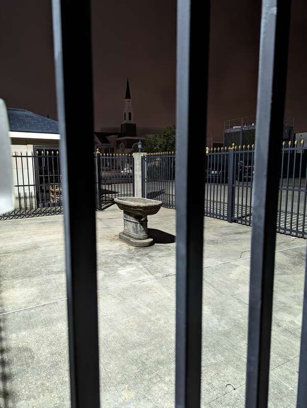 odd little courtyard. No gate. No obvious way to enter nor exit. and the only thing it contains is this oddly placed, oddly shaped... birdbath? sacrificial baby alter? an unused giant ashtray?