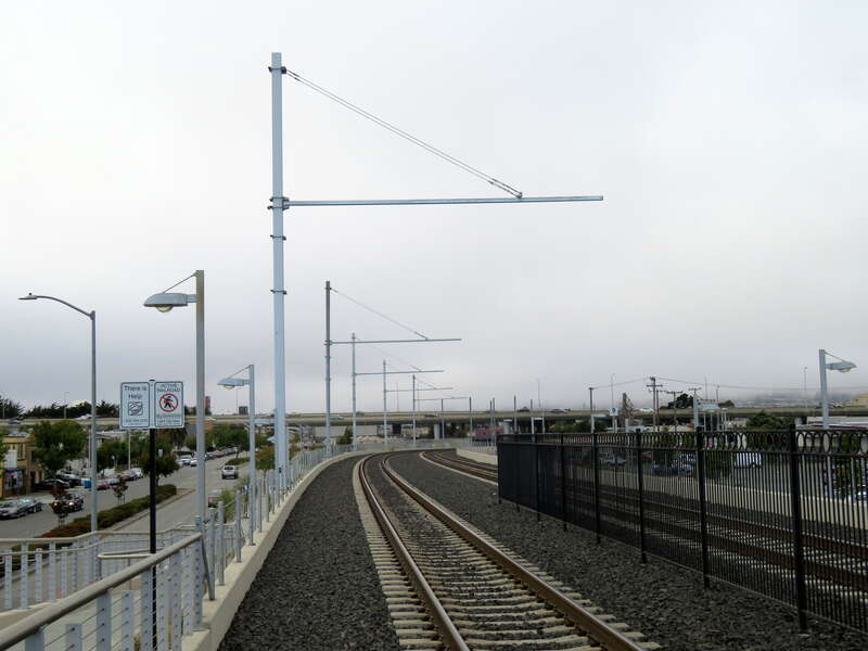 Newly installed catenary structures at the north end of San Bruno station in July 2018