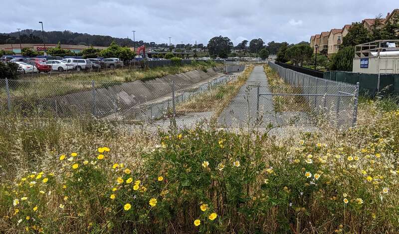 Colma Creek by South San Francisco BART station, looking northwest along the border with Colma, California