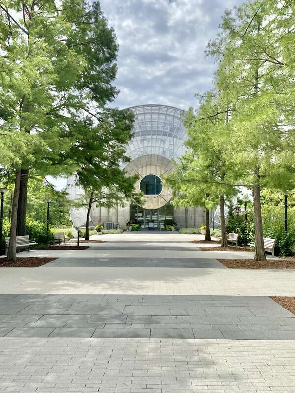 Built in 1983-1985, this Modern building was designed by Conklin and Rossant as part of the construction of the Myriad Botanical Gardens, which began construction in 1971.  The building consists of a large cylinder that is 224 feet (68 meters) long